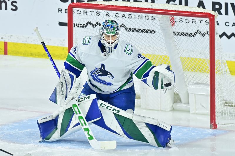 Apr 3, 2024; Tempe, Arizona, USA; Vancouver Canucks goaltender Arturs Silovs (31) makes a save in the first period against the Arizona Coyotes at Mullett Arena. Mandatory Credit: Matt Kartozian-USA TODAY Sports