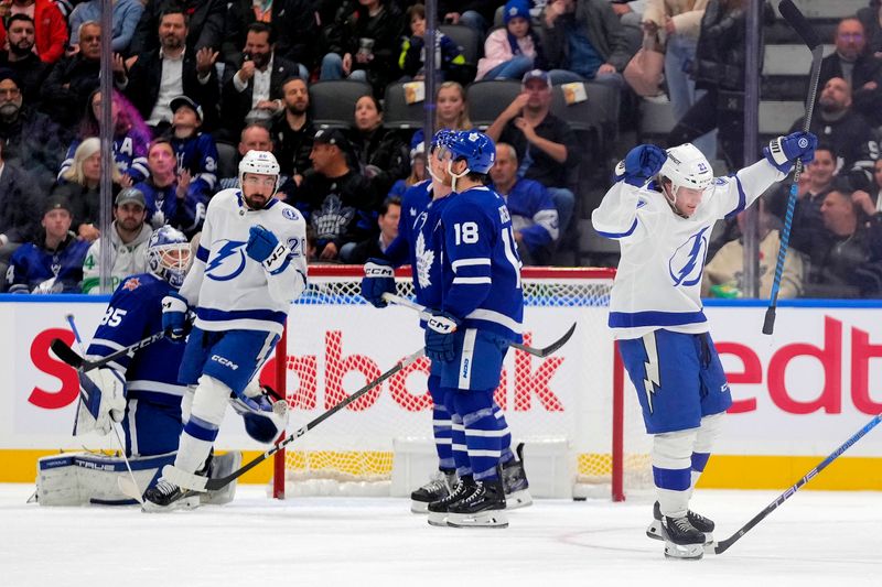 Nov 6, 2023; Toronto, Ontario, CAN; Tampa Bay Lightning forward Brayden Point (21) celebrates his goal against the Toronto Maple Leafs during the first period at Scotiabank Arena. Mandatory Credit: John E. Sokolowski-USA TODAY Sports