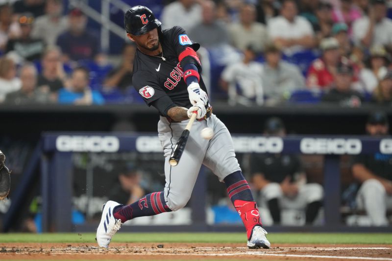 Jun 9, 2024; Miami, Florida, USA; Cleveland Guardians designated hitter Gabriel Arias (13) hits a solo home run in the second inning against the Miami Marlins at loanDepot Park. Mandatory Credit: Jim Rassol-USA TODAY Sports