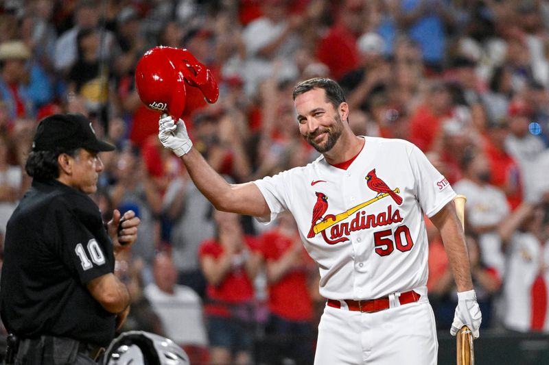 Sep 29, 2023; St. Louis, Missouri, USA;  St. Louis Cardinals pinch hitter Adam Wainwright (50) tips his cap as he receives a standing ovation from the fans before he bats against the Cincinnati Reds during the sixth inning at Busch Stadium. Mandatory Credit: Jeff Curry-USA TODAY Sports