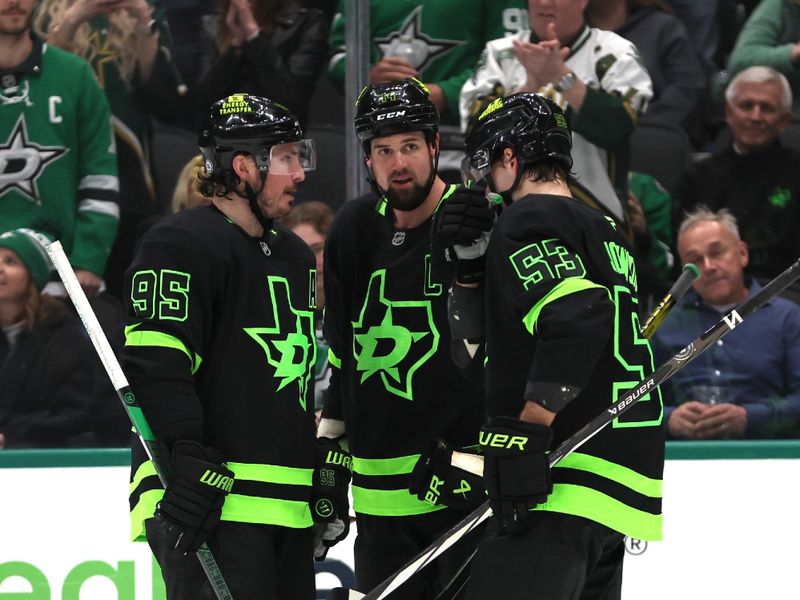 Dec 31, 2024; Dallas, Texas, USA; Dallas Stars center Matt Duchene (95) talks to left wing Jamie Benn (14) and center Wyatt Johnston (53) during the third period against the Buffalo Sabres at American Airlines Center. Mandatory Credit: Tim Heitman-Imagn Images