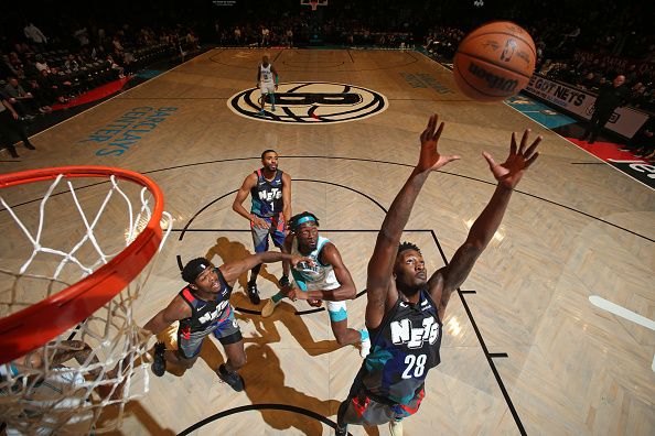 BROOKLYN, NY - NOVEMBER 30: Dorian Finney-Smith #28 of the Brooklyn Nets rebounds the ball during the game against the Charlotte Hornets on November 30, 2023 at Barclays Center in Brooklyn, New York. NOTE TO USER: User expressly acknowledges and agrees that, by downloading and or using this Photograph, user is consenting to the terms and conditions of the Getty Images License Agreement. Mandatory Copyright Notice: Copyright 2023 NBAE (Photo by Nathaniel S. Butler/NBAE via Getty Images)