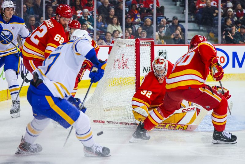 Mar 24, 2024; Calgary, Alberta, CAN; Calgary Flames goaltender Dustin Wolf (32) makes a save against the Buffalo Sabres during the first period at Scotiabank Saddledome. Mandatory Credit: Sergei Belski-USA TODAY Sports