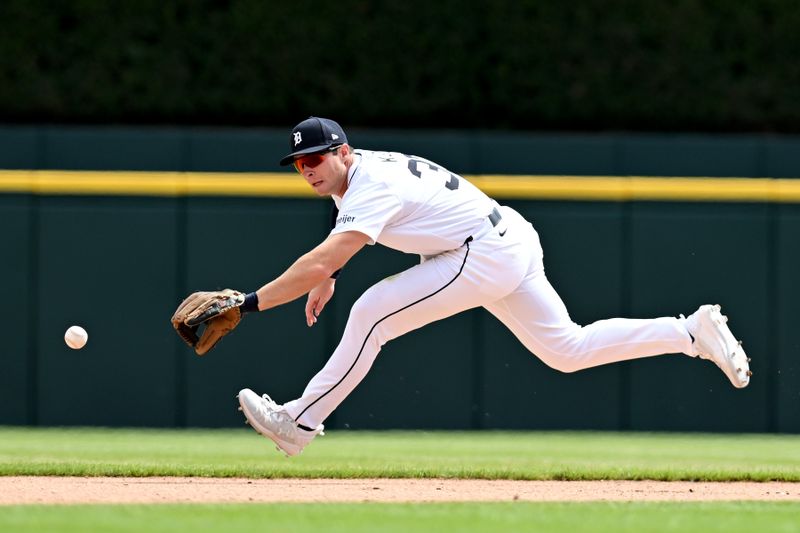 Apr 18, 2024; Detroit, Michigan, USA;  Detroit Tigers second base Colt Keith (33) fields a ground ball against the Texas Rangers in the sixth inning at Comerica Park. Mandatory Credit: Lon Horwedel-USA TODAY Sports