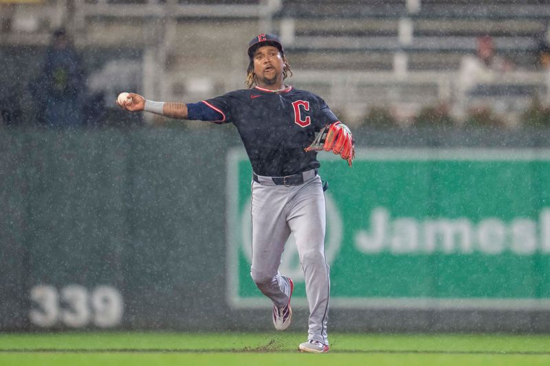 May 19, 2025; Minneapolis, Minnesota, USA; Cleveland Guardians third baseman Jose Ramirez (11) throws the ball to first base for an out against the Minnesota Twins in the third inning at Target Field. Mandatory Credit: Jesse Johnson-Imagn Images