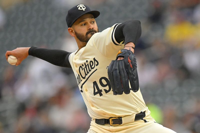 May 26, 2024; Minneapolis, Minnesota, USA;  Minnesota Twins pitcher Pablo Lopez (49) delivers a pitch against the Texas Rangers during the first inning at Target Field. Mandatory Credit: Nick Wosika-USA TODAY Sports