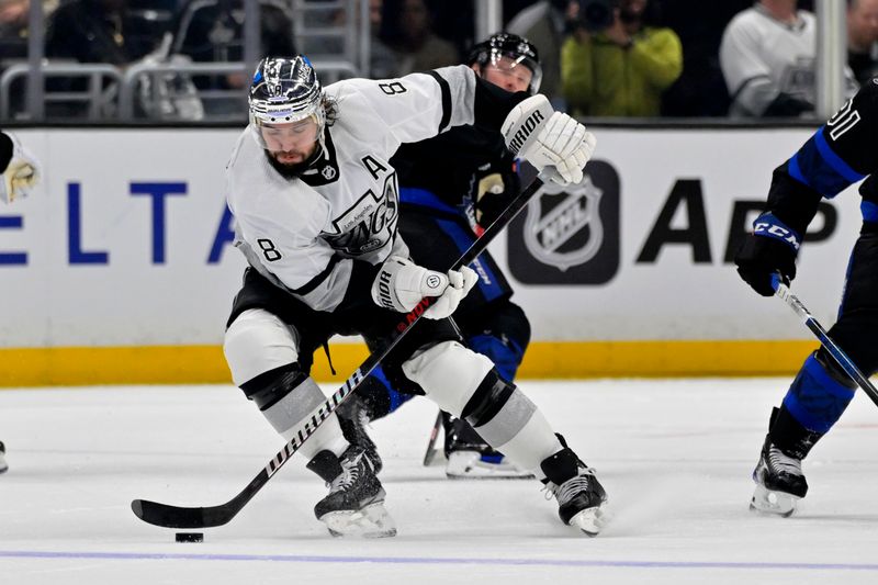 Jan 2, 2024; Los Angeles, California, USA; Los Angeles Kings defenseman Drew Doughty (8) handles the puck in the third period against the Toronto Maple Leafs at Crypto.com Arena. Mandatory Credit: Jayne Kamin-Oncea-USA TODAY Sports