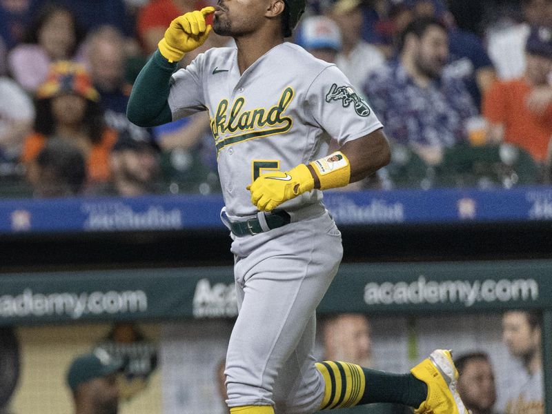 Sep 12, 2023; Houston, Texas, USA; Oakland Athletics left fielder Tony Kemp (5) rounds the bases after hitting a home run against the Houston Astros in the fifth inning at Minute Maid Park. Mandatory Credit: Thomas Shea-USA TODAY Sports