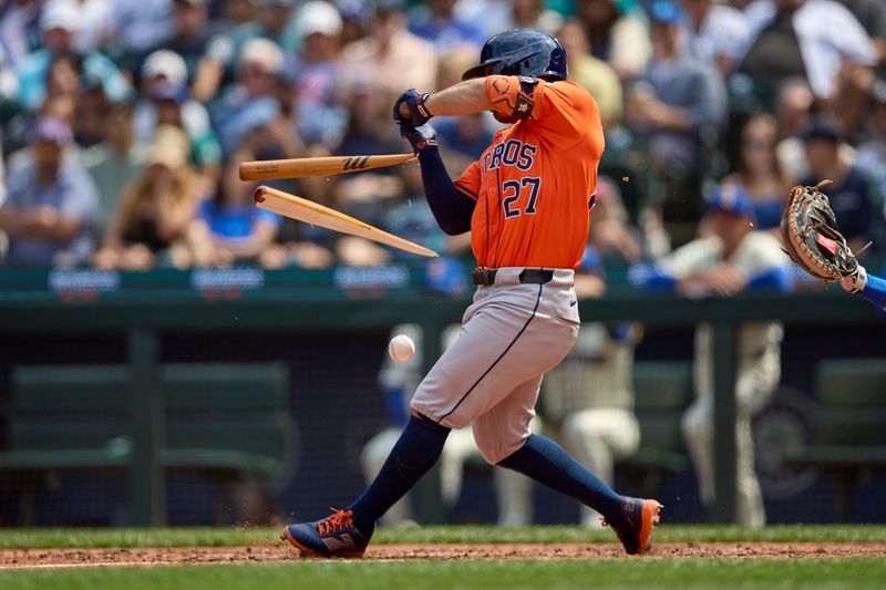 Jul 21, 2024; Seattle, Washington, USA; Houston Astros second baseman Jose Altuve (27) hreaks a bat on a single against the Seattle Mariners during the sixth inning  at T-Mobile Park. Mandatory Credit: John Froschauer-USA TODAY Sports