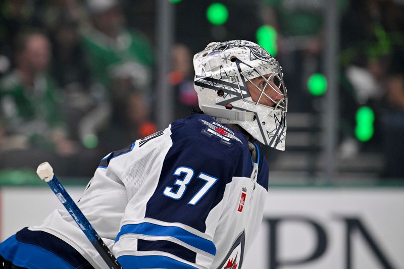 May 11, 2025; Dallas, Texas, USA; Winnipeg Jets goaltender Connor Hellebuyck (37) faces the Dallas Stars attack during the second period in game three of the second round of the 2025 Stanley Cup Playoffs at American Airlines Center. Mandatory Credit: Jerome Miron-Imagn Images