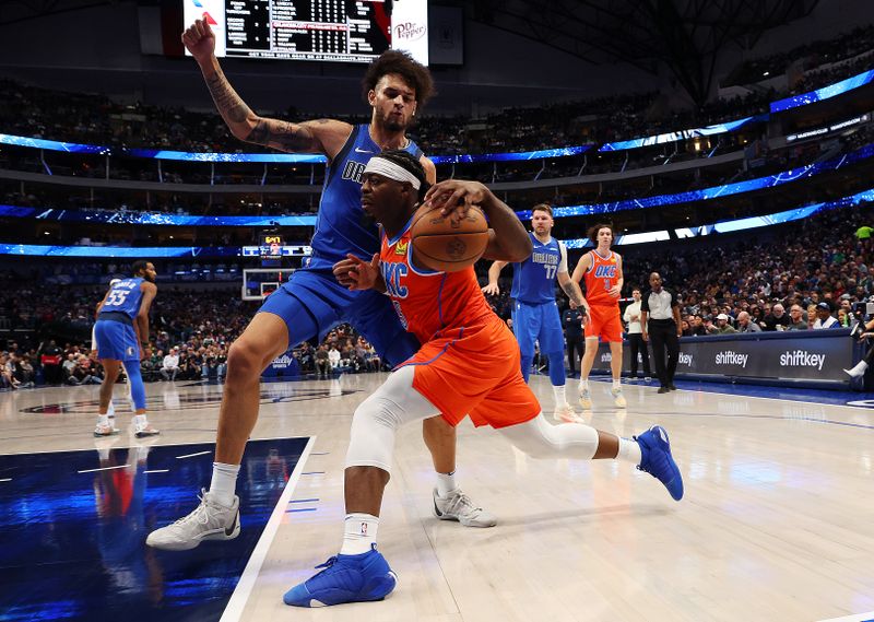 DALLAS, TEXAS - DECEMBER 02: Dereck Lively II #2 of the Dallas Mavericks defends as Luguentz Dort #5 of the Oklahoma City Thunder drives the ball in the first quarter at American Airlines Center on December 02, 2023 in Dallas, Texas. NOTE TO USER: User expressly acknowledges and agrees that, by downloading and or using this photograph, User is consenting to the terms and conditions of the Getty Images License Agreement. (Photo by Richard Rodriguez/Getty Images)