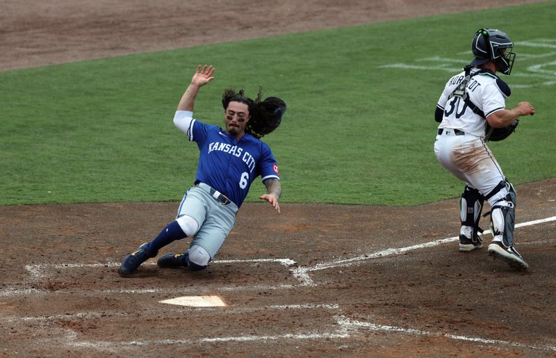 May 1, 2025; St. Petersburg, Florida, USA;  Kansas City Royals left fielder Jonathan India (6) slides save into home plate during the sixth inning against the Tampa Bay Rays  at George M. Steinbrenner Field. Mandatory Credit: Kim Klement Neitzel-Imagn Images