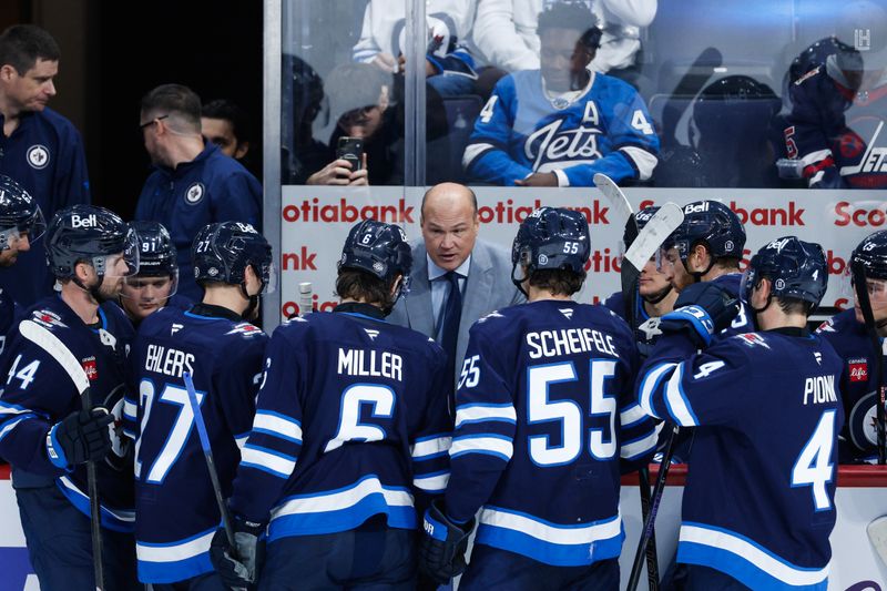 Oct 13, 2024; Winnipeg, Manitoba, CAN;  Winnipeg Jets assistant coach Davis Payne discusses strategy against the Minnesota Wild at the end of the third period at Canada Life Centre. Mandatory Credit: Terrence Lee-Imagn Images