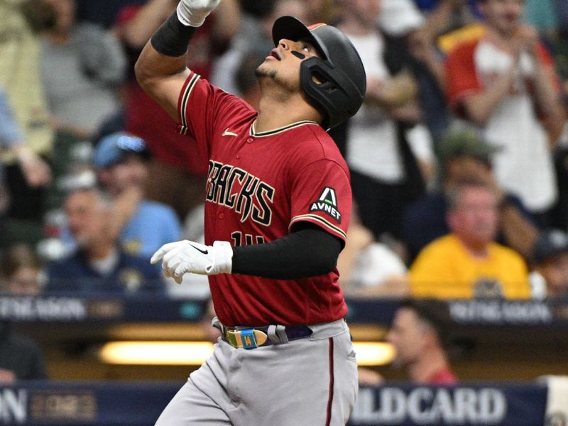 Oct 3, 2023; Milwaukee, Wisconsin, USA; Arizona Diamondbacks catcher Gabriel Moreno (14) celebrates after hitting a home run against the Milwaukee Brewers in the fourth inning during game one of the Wildcard series for the 2023 MLB playoffs at American Family Field. Mandatory Credit: Michael McLoone-USA TODAY Sports