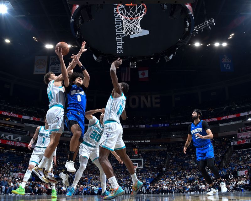 ORLANDO, FL - NOVEMBER 12: Anthony Black #0 of the Orlando Magic shoots the ball during the Emirates NBA Cup game against the Charlotte Hornets on November 12, 2024 at Kia Center in Orlando, Florida. NOTE TO USER: User expressly acknowledges and agrees that, by downloading and or using this photograph, User is consenting to the terms and conditions of the Getty Images License Agreement. Mandatory Copyright Notice: Copyright 2024 NBAE (Photo by Fernando Medina/NBAE via Getty Images)