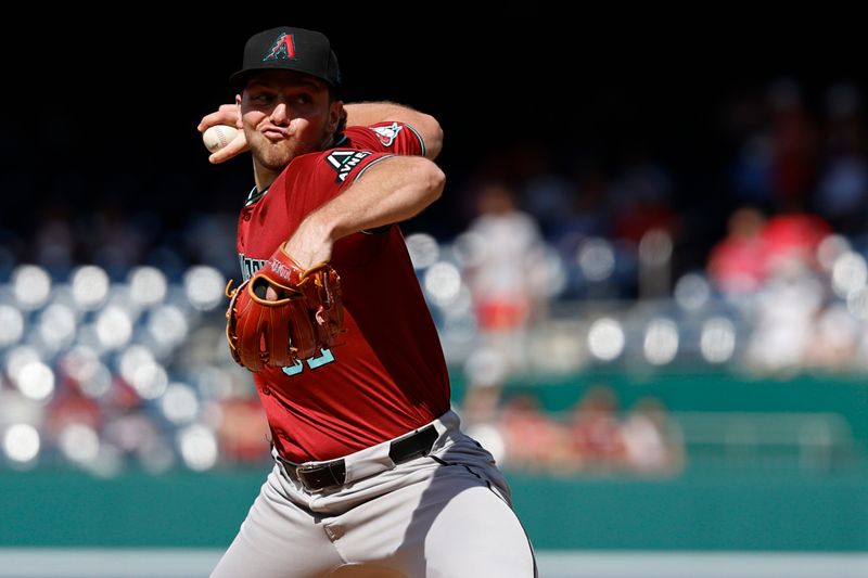 Jun 19, 2024; Washington, District of Columbia, USA; Arizona Diamondbacks starting pitcher Brandon Pfaadt (32) pitches against the Washington Nationals during the first inning at Nationals Park. Mandatory Credit: Geoff Burke-USA TODAY Sports