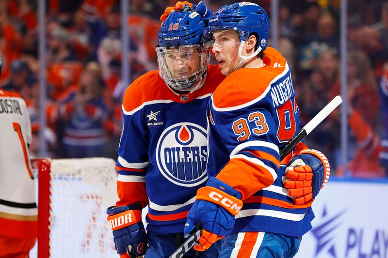 Jan 3, 2025; Edmonton, Alberta, CAN; Edmonton Oilers forward Ryan Nugent-Hopkins (93) celebrates with forward Zach Hyman (18) after scoring a goal during the first period against the Anaheim Ducks at Rogers Place. Mandatory Credit: Perry Nelson-Imagn Images