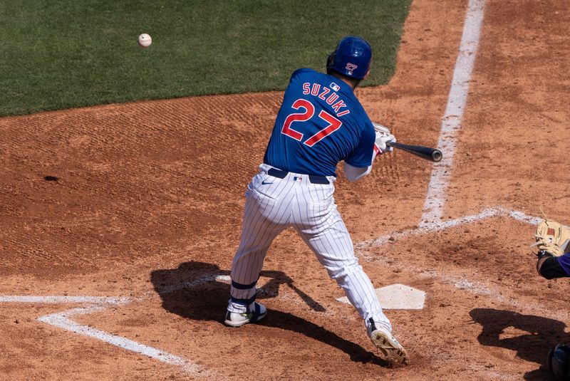 Mar 9, 2024; Mesa, Arizona, USA; Chicago Cubs outfielder Seiya Suzuki (27) bats against the Colorado Rockies in the fifth inning during a spring training game at Sloan Park. Mandatory Credit: Allan Henry-USA TODAY Sports