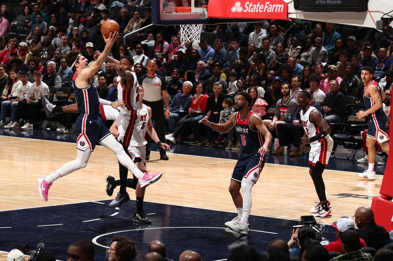 WASHINGTON, DC -? MARCH 31: Deni Avdija #8 of the Washington Wizards drives to the basket during the game against the Miami Heat on March 31, 2024 at Capital One Arena in Washington, DC. NOTE TO USER: User expressly acknowledges and agrees that, by downloading and or using this Photograph, user is consenting to the terms and conditions of the Getty Images License Agreement. Mandatory Copyright Notice: Copyright 2024 NBAE (Photo by Kenny Giarla/NBAE via Getty Images)