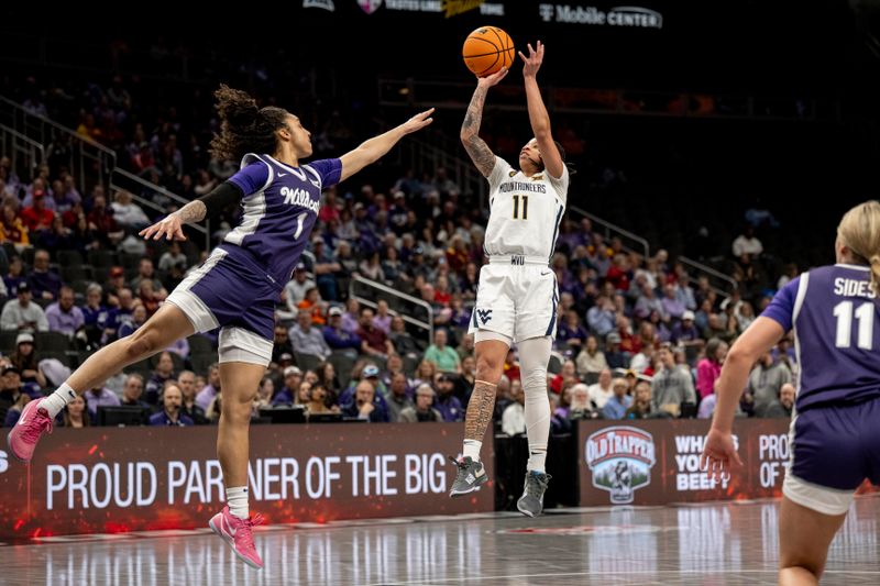 Mar 7, 2025; Kansas City, MO, USA; West Virginia Mountaineers JJ Quinerly (11) shoots the ball while defended by Kansas State Wildcats guard Zyanna Walker (1) in the first quarter at T-Mobile Center. Mandatory Credit: Amy Kontras-Imagn Images