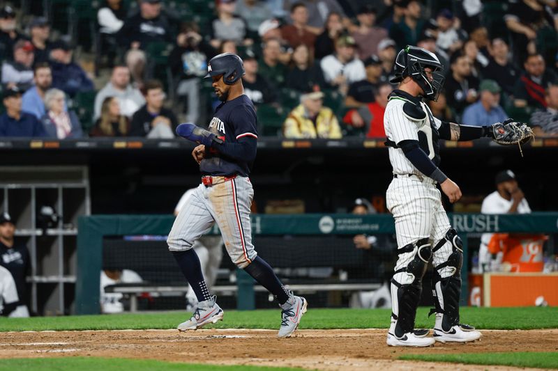Apr 30, 2024; Chicago, Illinois, USA; Minnesota Twins outfielder Byron Buxton (25) scores against the Chicago White Sox during the ninth inning at Guaranteed Rate Field. Mandatory Credit: Kamil Krzaczynski-USA TODAY Sports