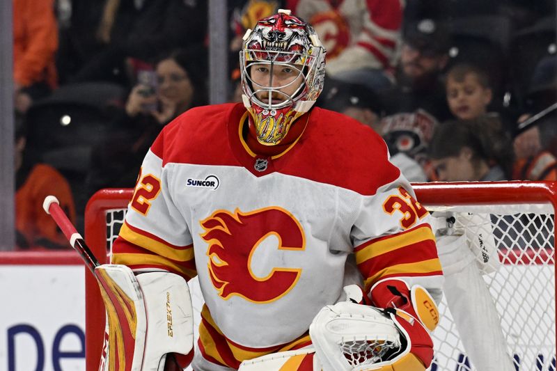 Nov 2, 2025; Philadelphia, Pennsylvania, USA; Calgary Flames goaltender Dustin Wolf (32) against the Philadelphia Flyers during the second period at Xfinity Mobile Arena. Mandatory Credit: Eric Hartline-Imagn Images
