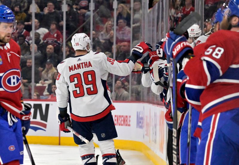 Feb 17, 2024; Montreal, Quebec, CAN; Washington Capitals forward Anthony Mantha (39) celebrates with teammates after scoring a goal against the Montreal Canadiens during the first period at the Bell Centre. Mandatory Credit: Eric Bolte-USA TODAY Sports