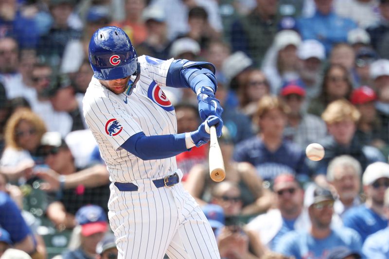 May 17, 2025; Chicago, Illinois, USA; Chicago Cubs second baseman Nico Hoerner (2) singles against the Chicago White Sox during the fifth inning at Wrigley Field. Mandatory Credit: Kamil Krzaczynski-Imagn Images