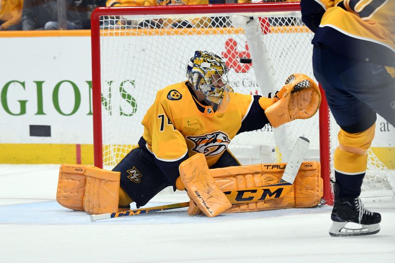 Feb 27, 2024; Nashville, Tennessee, USA; Nashville Predators goaltender Juuse Saros (74) makes a save during the second period against the Ottawa Senators at Bridgestone Arena. Mandatory Credit: Christopher Hanewinckel-USA TODAY Sports