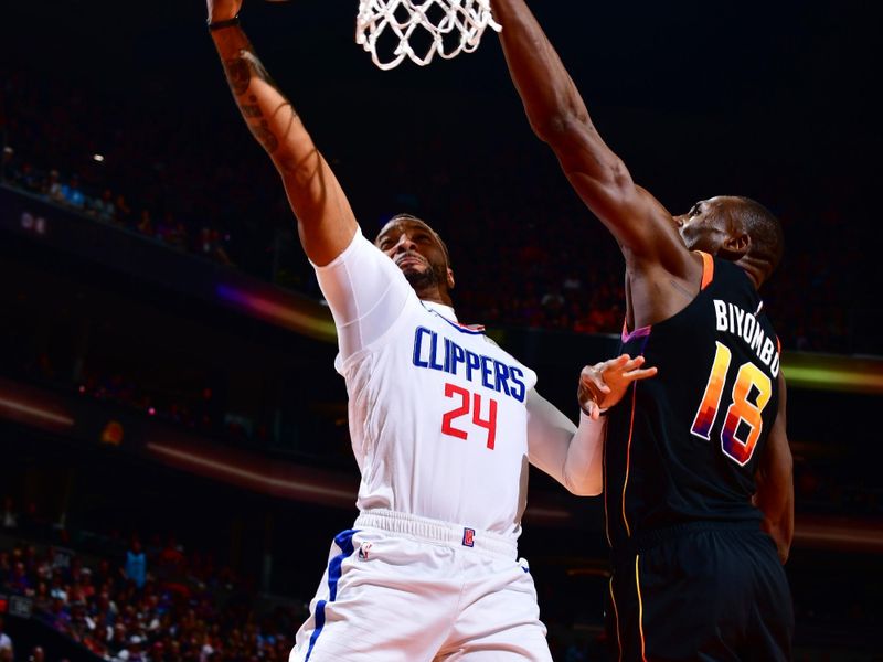 PHOENIX, AZ - APRIL 16:  Norman Powell #24 of the LA Clippers goes to the basket during the game During round one game one of the 2023 NBA Playoffs on April 16, 2023 at Footprint Center in Phoenix, Arizona. NOTE TO USER: User expressly acknowledges and agrees that, by downloading and or using this photograph, user is consenting to the terms and conditions of the Getty Images License Agreement. Mandatory Copyright Notice: Copyright 2023 NBAE (Photo by Barry Gossage/NBAE via Getty Images)