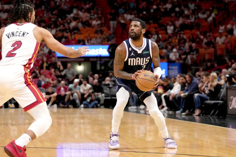 MIAMI, FL - APRIL 1:  Kyrie Irving #2 of the Dallas Mavericks shoots a three point basket against the Miami Heat on April 1, 2023 at FTX Arena in Miami, Florida. NOTE TO USER: User expressly acknowledges and agrees that, by downloading and or using this Photograph, user is consenting to the terms and conditions of the Getty Images License Agreement. Mandatory Copyright Notice: Copyright 2023 NBAE (Photo by Issac Baldizon/NBAE via Getty Images)