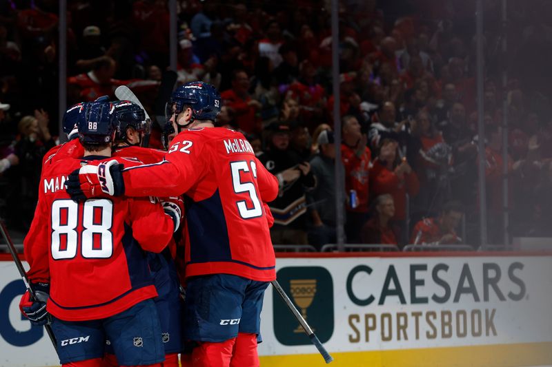 Nov 2, 2024; Washington, District of Columbia, USA; Washington Capitals left wing Andrew Mangiapane (88) celebrates with teammates after scoring a goal against the Columbus Blue Jackets in the first period at Capital One Arena. Mandatory Credit: Geoff Burke-Imagn Images