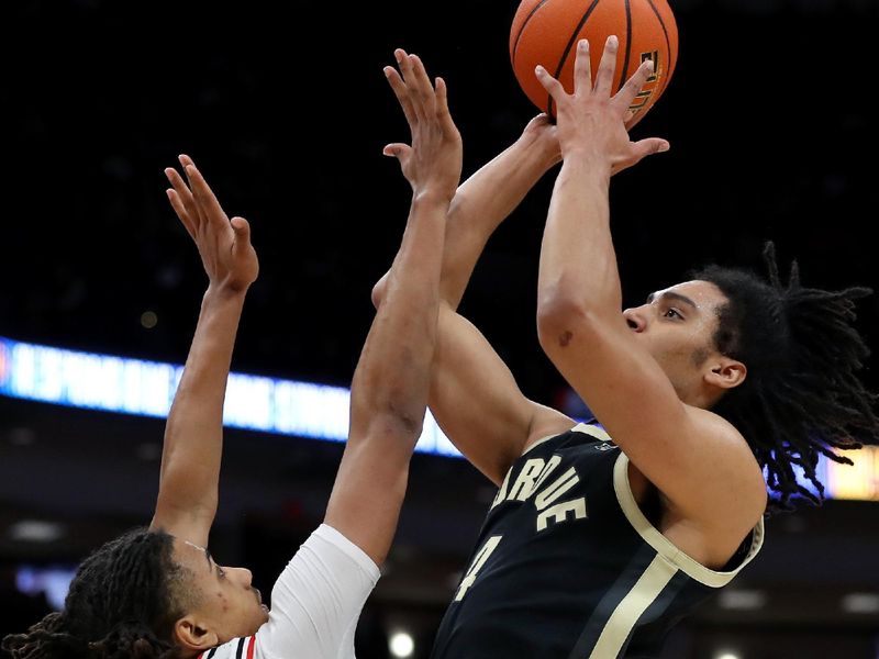 Feb 18, 2024; Columbus, Ohio, USA;  Purdue Boilermakers forward Trey Kaufman-Renn (4) takes the shot over Ohio State Buckeyes forward Devin Royal (21) during the first half at Value City Arena. Mandatory Credit: Joseph Maiorana-USA TODAY Sports