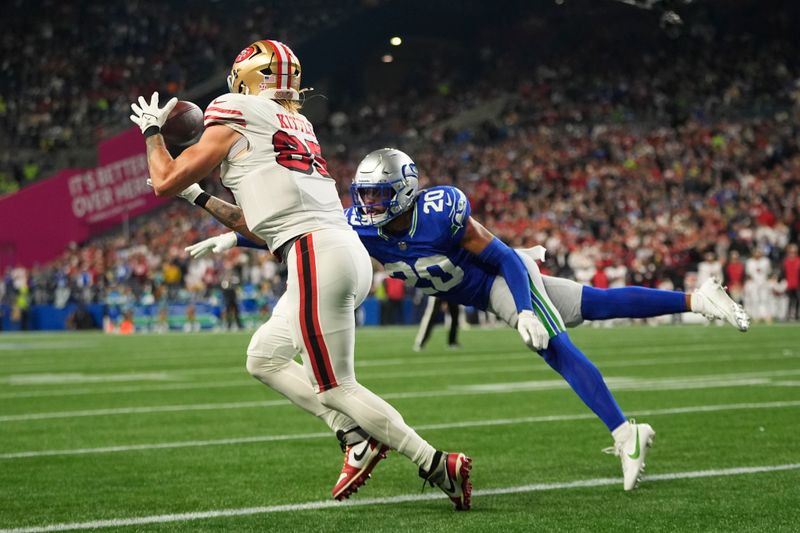 San Francisco 49ers' George Kittle (85) makesna touchdown catch against the Seattle Seahawks, Thursday, Oct. 10, 2024, in Seattle. (AP Photo/Lindsey Wasson)