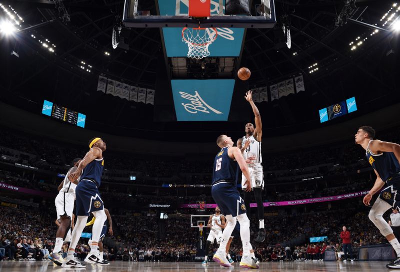 DENVER, CO - MARCH 12: Nicolas Claxton #33 of the Brooklyn Nets shoots the ball during the game against the Denver Nuggets on March 12, 2023 at the Ball Arena in Denver, Colorado. NOTE TO USER: User expressly acknowledges and agrees that, by downloading and/or using this Photograph, user is consenting to the terms and conditions of the Getty Images License Agreement. Mandatory Copyright Notice: Copyright 2023 NBAE (Photo by Garrett Ellwood/NBAE via Getty Images)