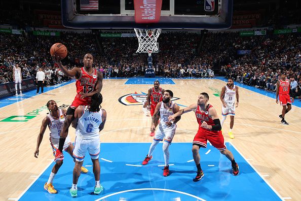 OKLAHOMA CITY, OK - NOVEMBER 22:  Ayo Dosunmu #12 of the Chicago Bulls drives to the basket during the game against the Oklahoma City Thunder on November 22, 2023 at Paycom Arena in Oklahoma City, Oklahoma. NOTE TO USER: User expressly acknowledges and agrees that, by downloading and or using this photograph, User is consenting to the terms and conditions of the Getty Images License Agreement. Mandatory Copyright Notice: Copyright 2023 NBAE (Photo by Zach Beeker/NBAE via Getty Images)