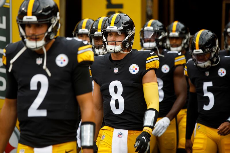 Pittsburgh Steelers quarterback Kenny Pickett (8) walks onto the field before a preseason NFL football game, Saturday, Aug. 13, 2022, in Pittsburgh, PA. (AP Photo/Matt Durisko)