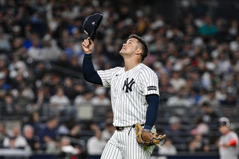 Jun 8, 2025; Bronx, New York, USA; New York Yankees pitcher Fernando Cruz (63) reacts after leaving the game during the sixth inning against the Boston Red Sox at Yankee Stadium. Mandatory Credit: John Jones-Imagn Images