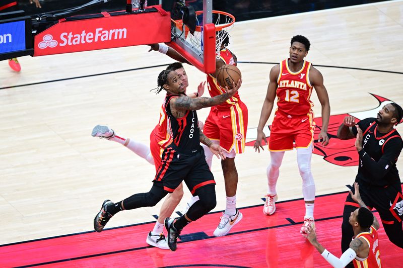 CHICAGO, IL - APRIL 1: DeMar DeRozan #11 of the Chicago Bulls drives to the basket during the game against the Atlanta Hawks on April 1, 2024 at United Center in Chicago, Illinois. NOTE TO USER: User expressly acknowledges and agrees that, by downloading and or using this photograph, User is consenting to the terms and conditions of the Getty Images License Agreement. Mandatory Copyright Notice: Copyright 2024 NBAE (Photo by Adam Hagy/NBAE via Getty Images)