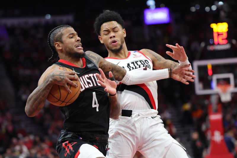 HOUSTON, TEXAS - NOVEMBER 22: Jalen Green #4 of the Houston Rockets handles the ball against Anfernee Simons #1 of the Portland Trail Blazers during the second half in the NBA Emirates Cup at Toyota Center on November 22, 2024 in Houston, Texas.  NOTE TO USER: User expressly acknowledges and agrees that, by downloading and or using this photograph, User is consenting to the terms and conditions of the Getty Images License Agreement. (Photo by Alex Slitz/Getty Images)