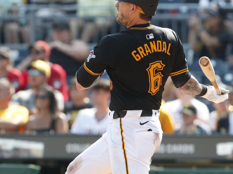 Aug 4, 2024; Pittsburgh, Pennsylvania, USA;  Pittsburgh Pirates catcher Yasmani Grandal (6) hits a single against the Arizona Diamondbacks during the ninth inning at PNC Park. Arizona won 6-5. Mandatory Credit: Charles LeClaire-USA TODAY Sports