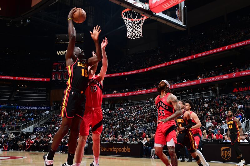 ATLANTA, GA - February 23: Clint Capela #15 of the Atlanta Hawks drives to the basket during the game against the Toronto Raptors on February 23, 2024 at State Farm Arena in Atlanta, Georgia.  NOTE TO USER: User expressly acknowledges and agrees that, by downloading and/or using this Photograph, user is consenting to the terms and conditions of the Getty Images License Agreement. Mandatory Copyright Notice: Copyright 2024 NBAE (Photo by Scott Cunningham/NBAE via Getty Images)