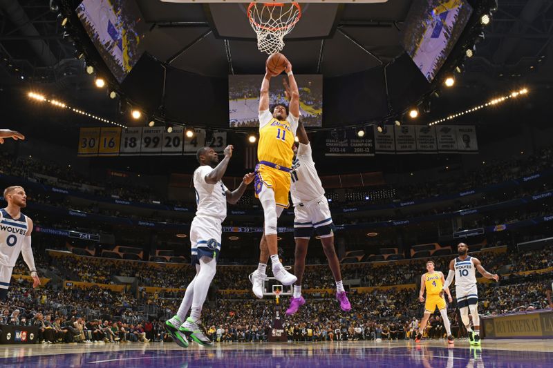 LOS ANGELES, CA - OCTOBER 22: Jaxson Hayes #11 of the Los Angeles Lakers drives to the basket during the game against the Minnesota Timberwolves on October 22, 2024 at Crypto.Com Arena in Los Angeles, California. NOTE TO USER: User expressly acknowledges and agrees that, by downloading and/or using this Photograph, user is consenting to the terms and conditions of the Getty Images License Agreement. Mandatory Copyright Notice: Copyright 2024 NBAE (Photo by Adam Pantozzi/NBAE via Getty Images)