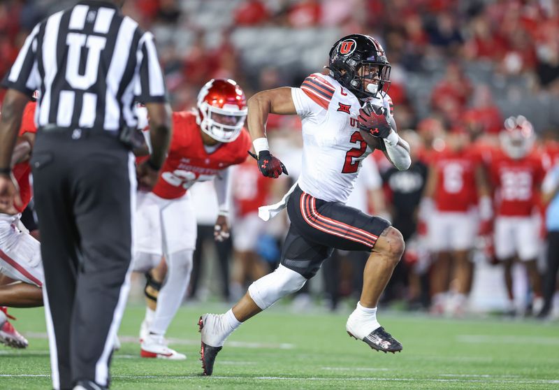 Oct 26, 2024; Houston, Texas, USA; Utah Utes running back Micah Bernard (2) runs with the ball and scores a touchdown during the third quarter against the Houston Cougars at TDECU Stadium. Mandatory Credit: Troy Taormina-Imagn Images