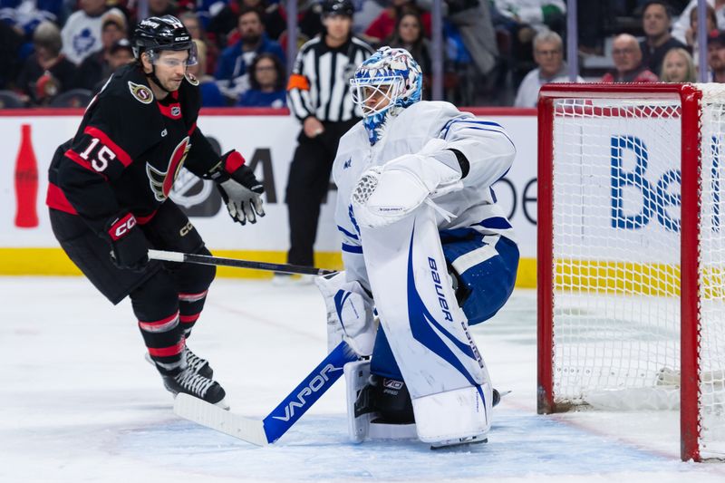 Jan 25, 2025; Ottawa, Ontario, CAN; Ottawa Senators center Matthew Highmore (15) skates past Toronto Maple Leafs goalie Joseph Woll (60) in the first period at the Canadian Tire Centre. Mandatory Credit: Marc DesRosiers-Imagn Images