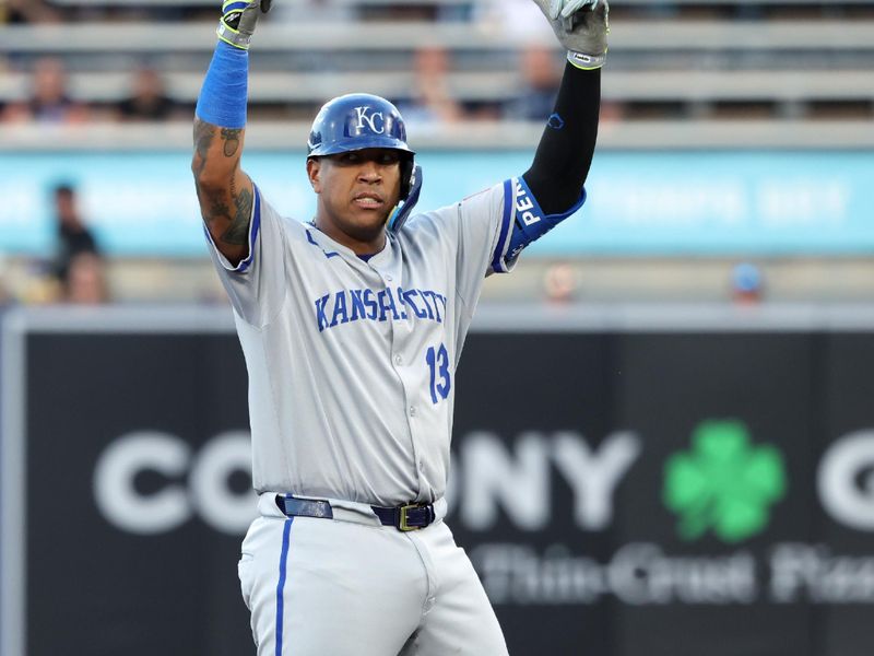 Apr 29, 2025; St. Petersburg, Florida, USA; Kansas City Royals catcher Salvador Perez (13) reacts after hitting a RBI double against the Tampa Bay Ray during the first inning  at George M. Steinbrenner Field. Mandatory Credit: Kim Klement Neitzel-Imagn Images