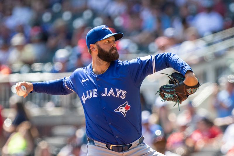 Sep 8, 2024; Cumberland, Georgia, USA; Toronto Blue Jays pitcher Tommy Nance (45) pitches the ball against the Atlanta Braves  during the sixth inning at Truist Park. Mandatory Credit: Jordan Godfree-Imagn Images