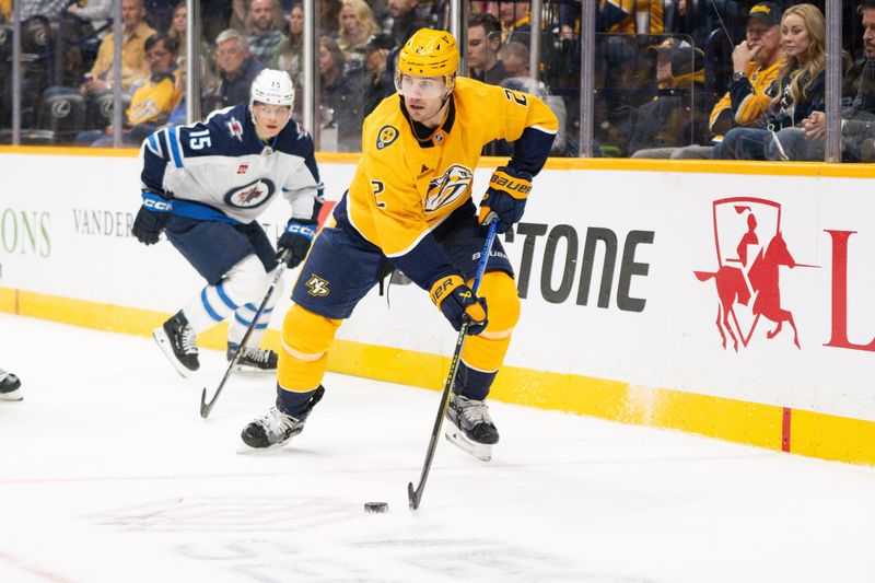 Nov 23, 2024; Nashville, Tennessee, USA;  Nashville Predators defenseman Luke Schenn (2) skates behind the net against the Winnipeg Jets during the second period at Bridgestone Arena. Mandatory Credit: Steve Roberts-Imagn Images