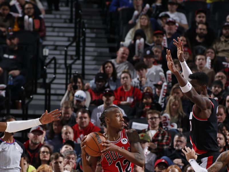 PORTLAND, OR - JANUARY 28: Ayo Dosunmu #12 of the Chicago Bulls handles the ball during the game against the Portland Trail Blazers on January 28, 2024 at the Moda Center Arena in Portland, Oregon. NOTE TO USER: User expressly acknowledges and agrees that, by downloading and or using this photograph, user is consenting to the terms and conditions of the Getty Images License Agreement. Mandatory Copyright Notice: Copyright 2024 NBAE (Photo by Cameron Browne/NBAE via Getty Images)