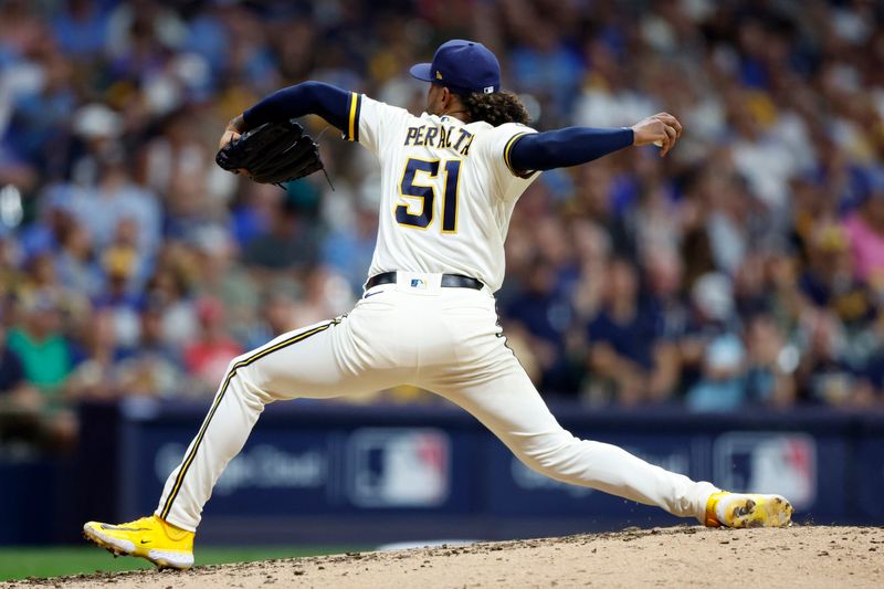 Oct 4, 2023; Milwaukee, Wisconsin, USA; Milwaukee Brewers starting pitcher Freddy Peralta (51) pitches against the Arizona Diamondbacks in the sixth inning during game two of the Wildcard series for the 2023 MLB playoffs at American Family Field. Mandatory Credit: Kamil Krzaczynski-USA TODAY Sports